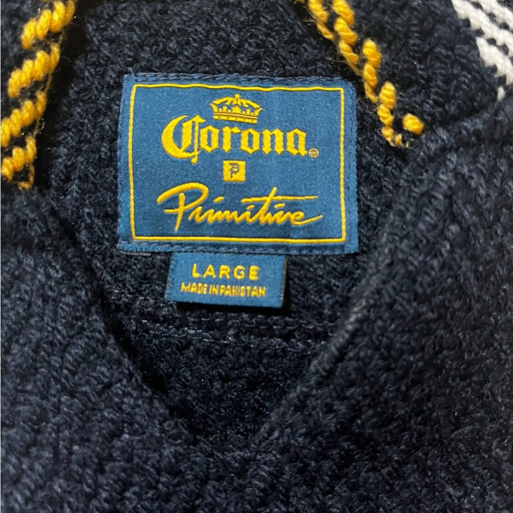 Corona X Primitive Collection Navy and Yellow Knit sweater.